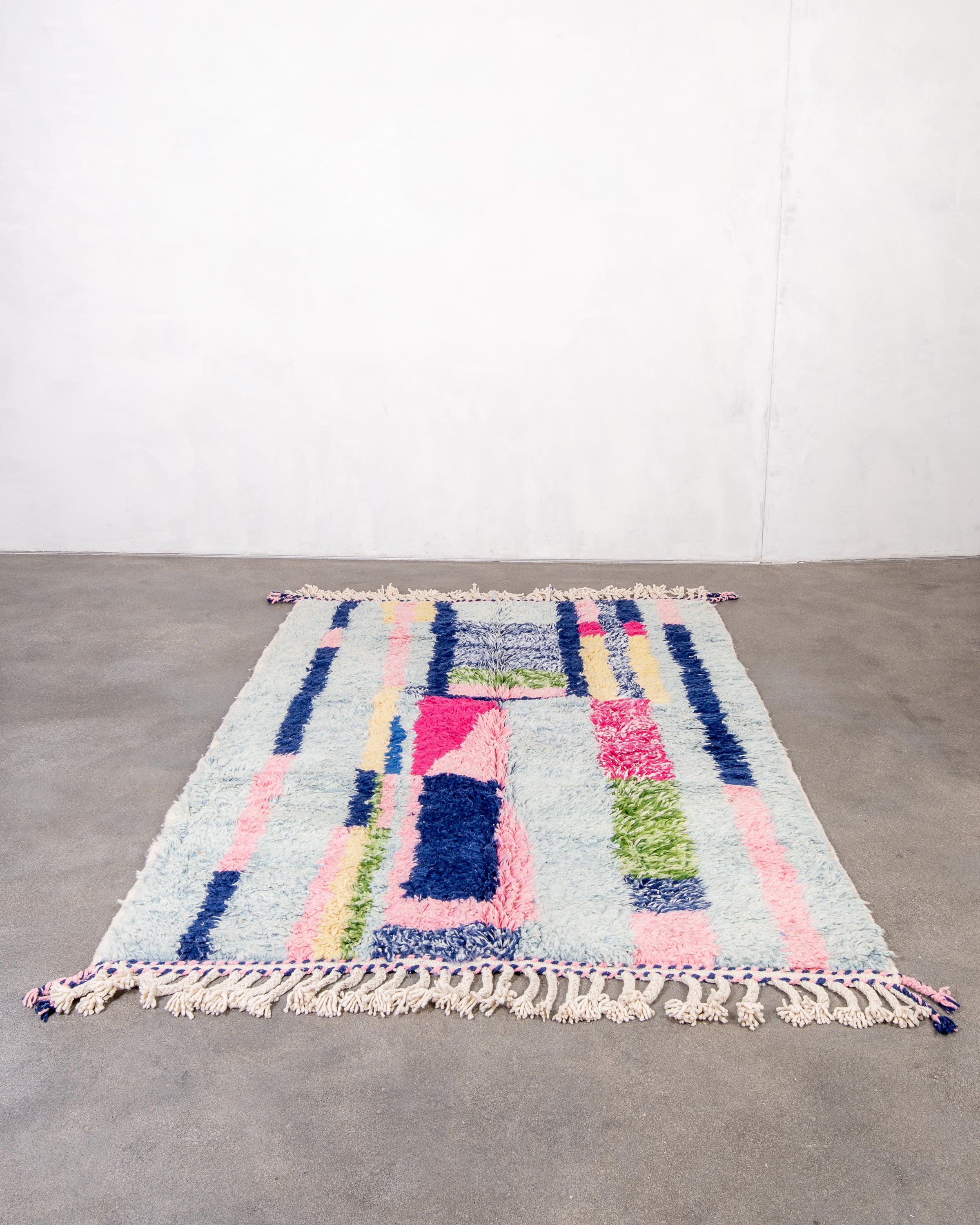Modern, designer, handcrafted Berber rug from Morocco. Beniourain carpet with beautiful colors and patterns and fluffy wool texture.